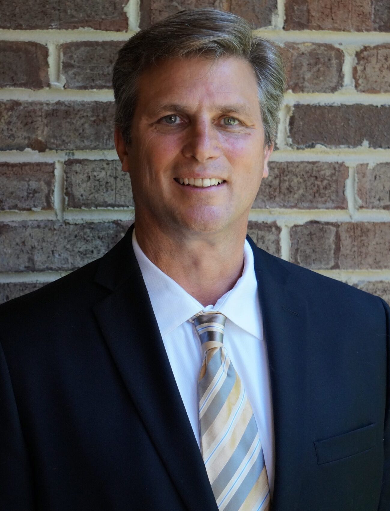 portrait photography of man wearing black suit jacket